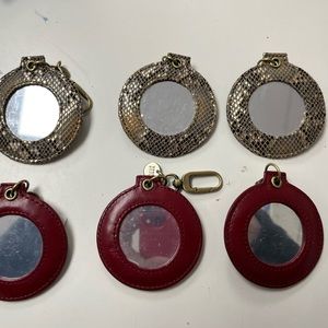 Hobo clip on mirrors to attach to your bag. See photo